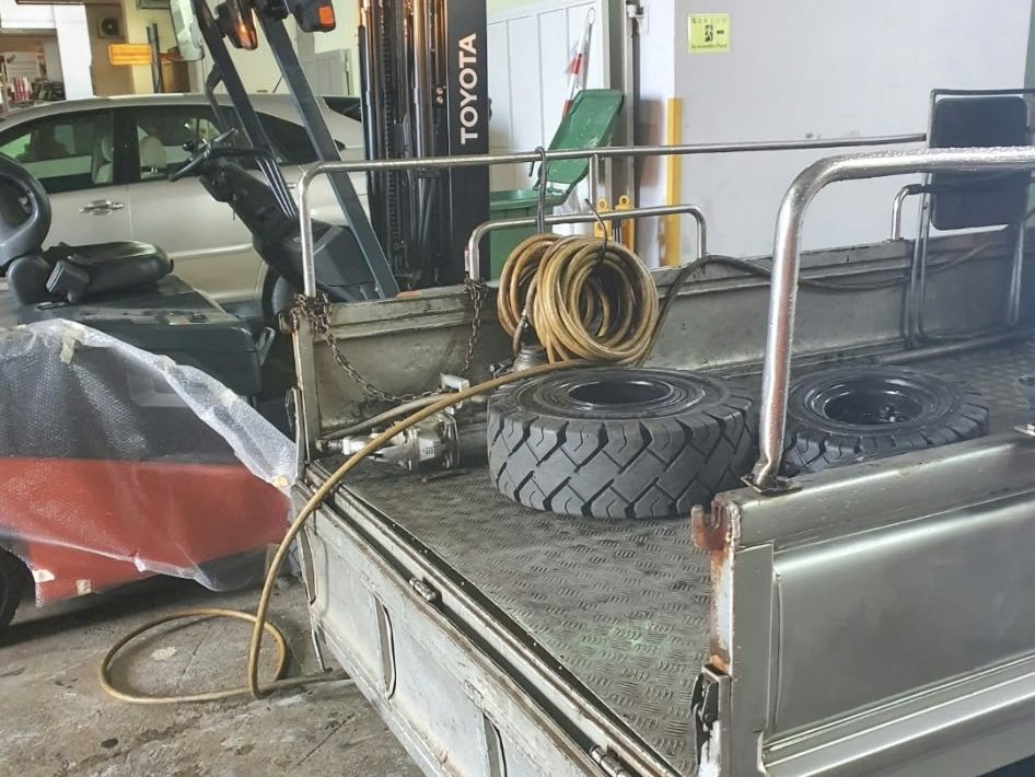 Replacement forklift tyres on the service truck
