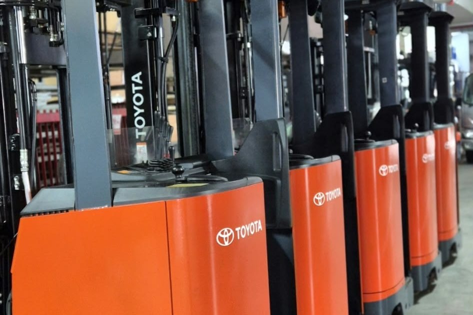 Row of Toyota electric reach trucks ready for sale